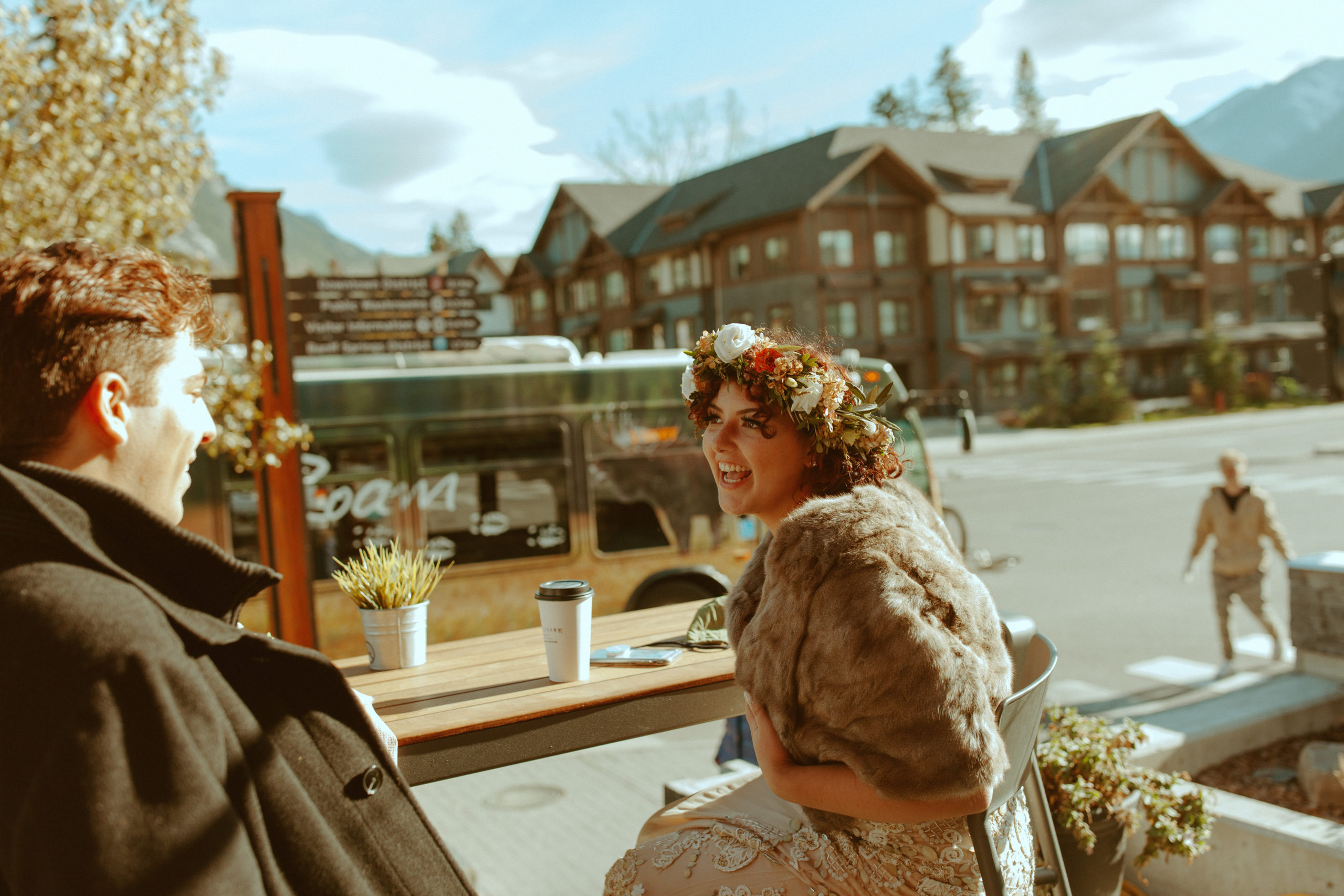 bride-laughing-on-banff-coffee-shop-patio